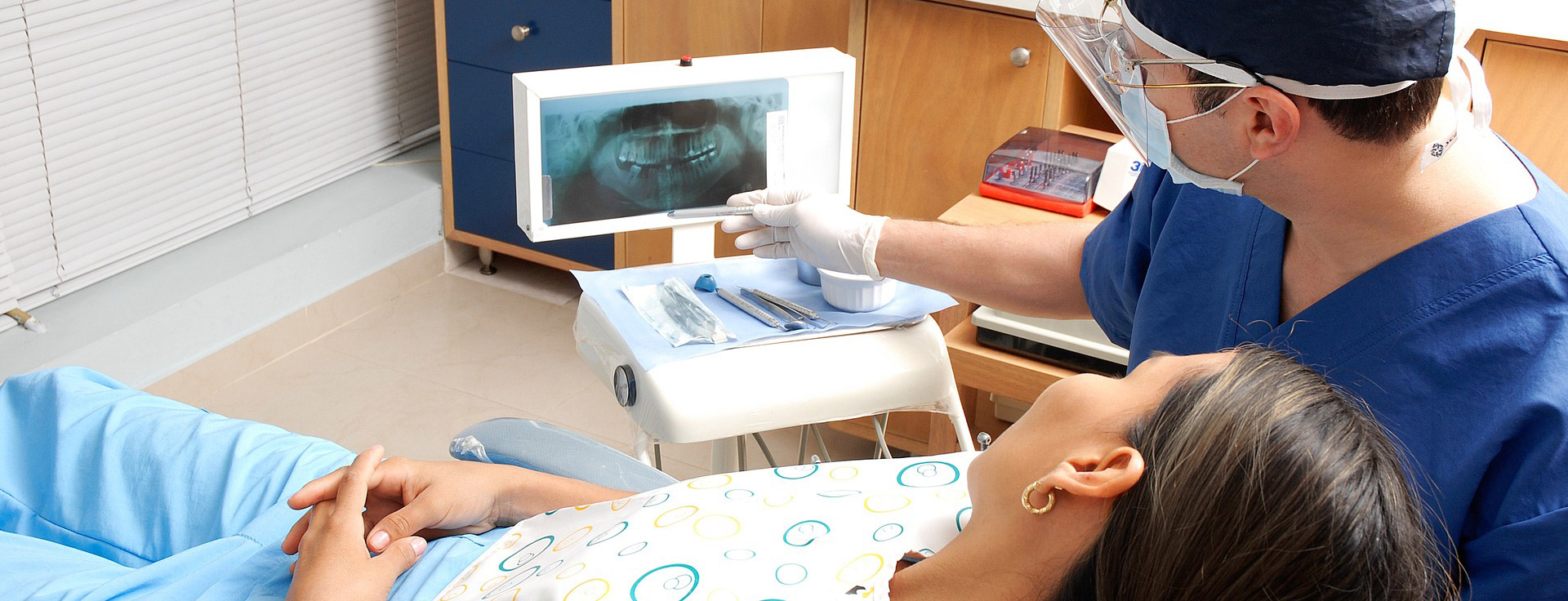 dentist showing patient scan of teeth