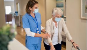 Care worker helping elderly women