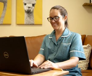 nurse using Radar Healthcare on laptop